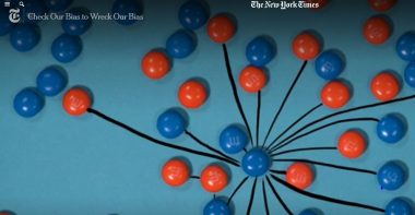 Still from the film showing orange and blue m&ms which are connected by marker lines