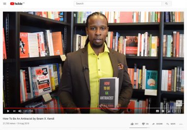 Screenshot of the YouTube video showing Ibram X. Kendi holding his book