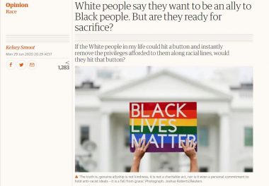 Screenshot of the Guardian article showing a rainbow-coloured Black Lives Matter sign held up by two white hands