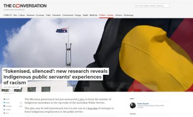 Screenshot of the Conversation article showing an Aboriginal flag flying near Parliament House in Australia