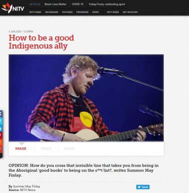 Screenshot of NITV article showing Ed Sheeran performing in a T-shirt with the Aboriginal flag