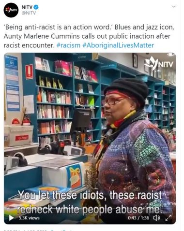 Screenshot of the film showing Marlene Cummins talking to an unseen bookshop owner saying 'You let these idiots, these racist redneck white people abuse me.'