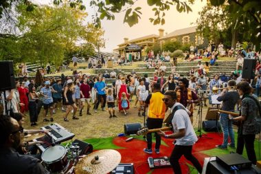 Bluestone Sessions - a crowd of kids an adults dances in front of a band in an outdoor amphitheatre