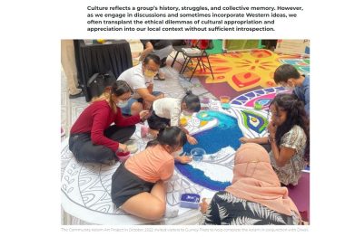 Children and adults working together on a Kolam Art Project for Diwali