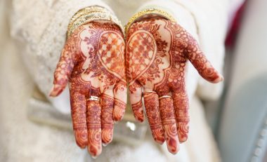 Henna hands for an Indian wedding with a love heart in the centre