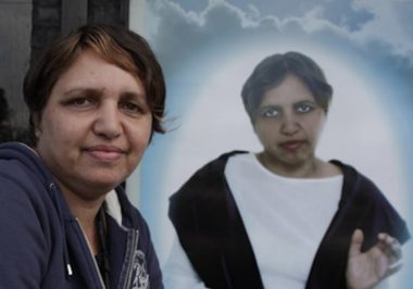 Dianne Jones in front of a portrait of herself