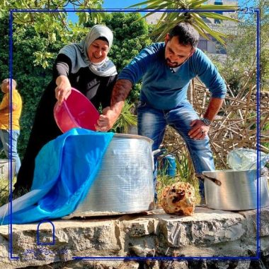 A man and woman preparing food at Palestine’s Khalil Sakakini Cultural Center