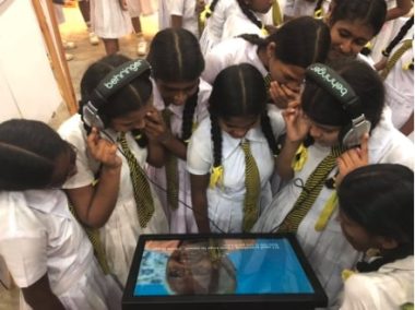 Schoolchildren receiving an interactive museum experience at 