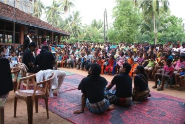 Janakaraliya’s performers discussing social issues with the audience in the street theatre performances.