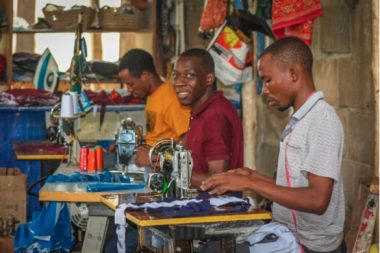 Africraft staff members working in the tailoring section