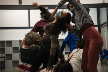 Women dancing with masks on